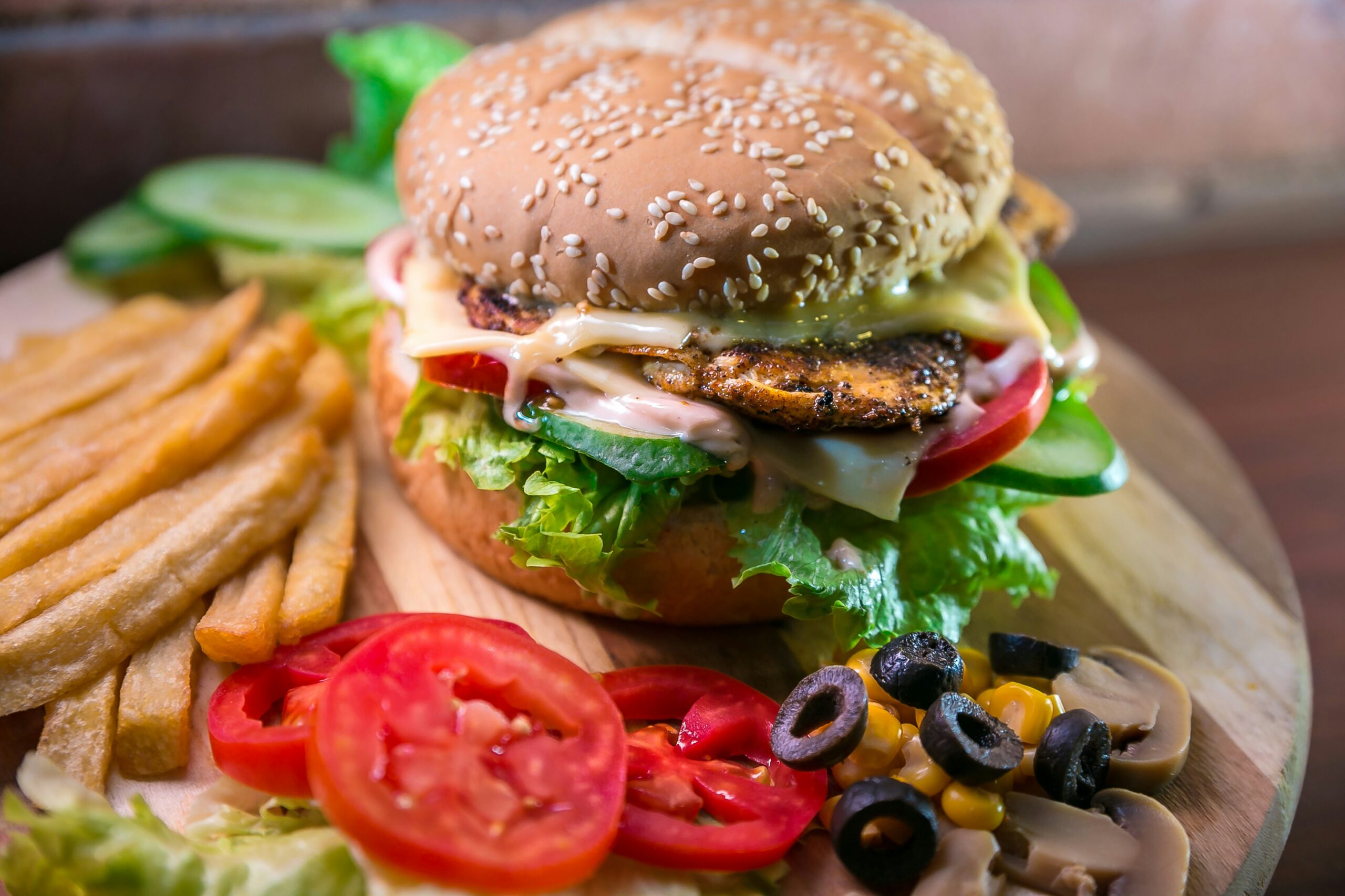 haseeb-jamil-J9lD6FS6_cs-unsplash A photo of burger, chips, and salad